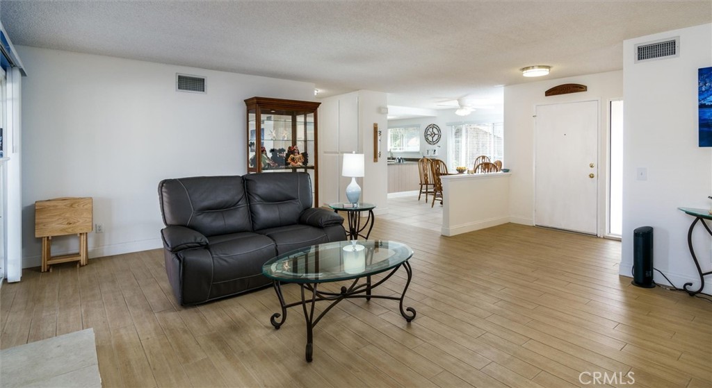 27062 Terrytown Road Menifee, CA 92586 - Photo 8 of 36 a living room with furniture and a wooden floor