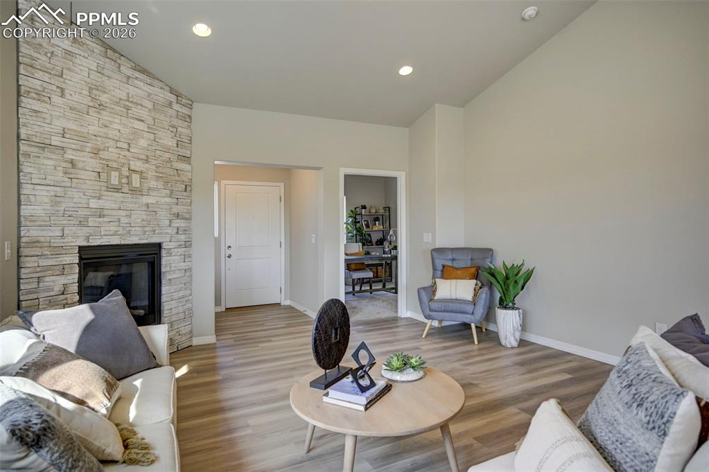 5167 Truscott Road Colorado Springs, CO 80925 - Photo 11 of 20 a living room with furniture and a fireplace
