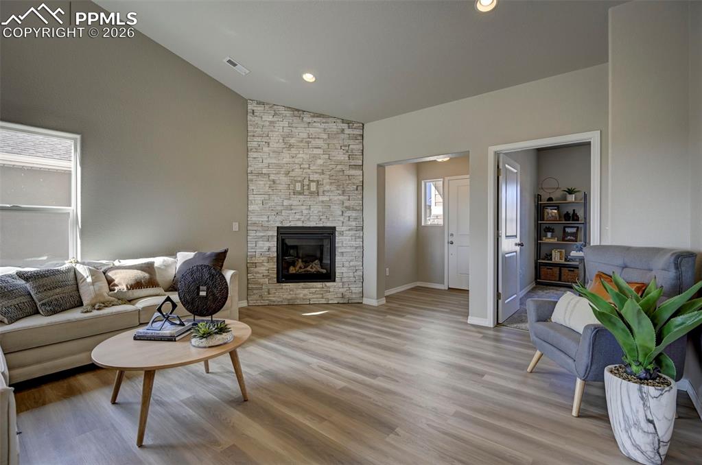 5167 Truscott Road Colorado Springs, CO 80925 - Photo 12 of 20 a living room with furniture and a fireplace