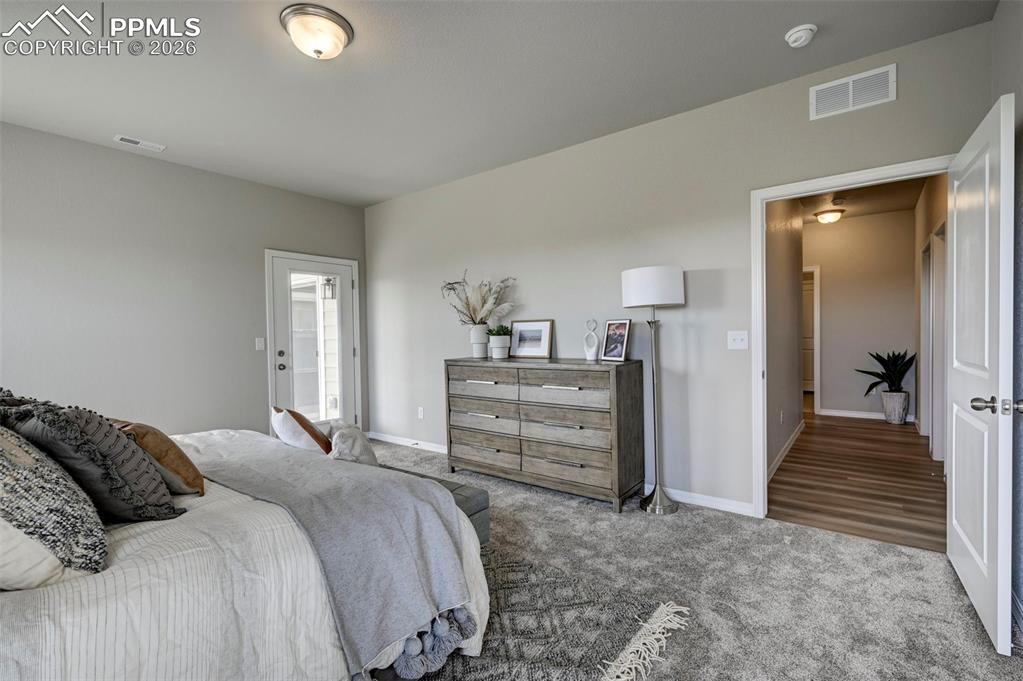 5167 Truscott Road Colorado Springs, CO 80925 - Photo 16 of 20 a bedroom with a bed and a view of bedroom