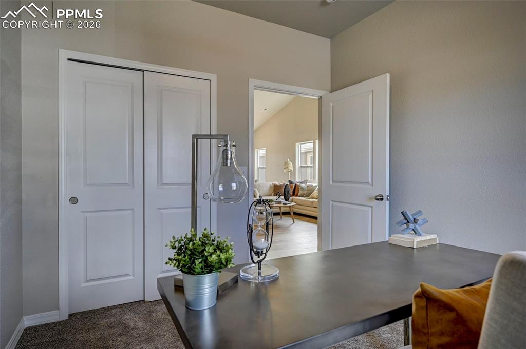 5167 Truscott Road Colorado Springs, CO 80925 - Photo 4 of 20 a view of kitchen and living room