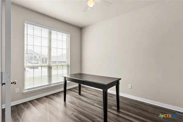 a view of a livingroom with furniture and window