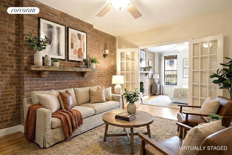 a living room with furniture and a potted plant