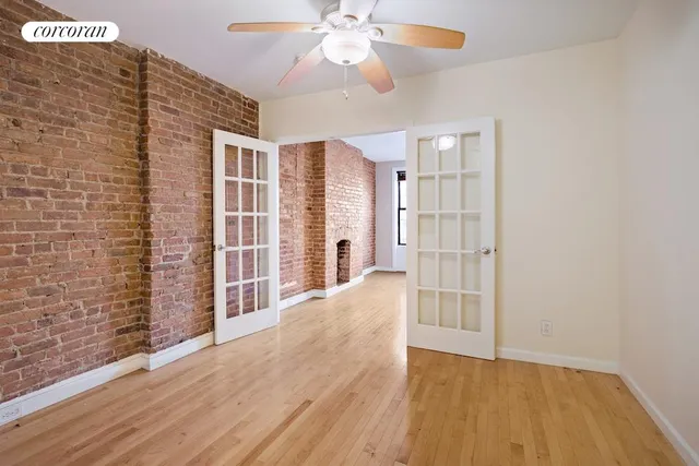 a view of an empty room with a fireplace