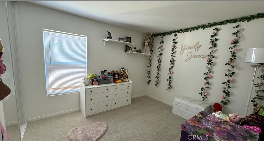 29045 Silver Stirrup Way Winchester, CA 92596 - Photo 3 of 11 a view of walk in closet with clothes and shoes
