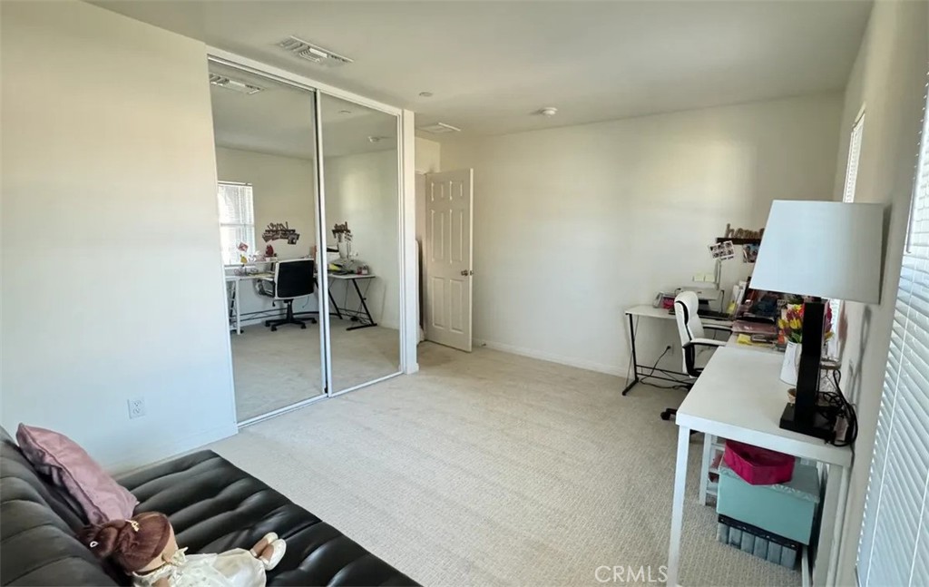 29045 Silver Stirrup Way Winchester, CA 92596 - Photo 5 of 11 a room with furniture and a chair