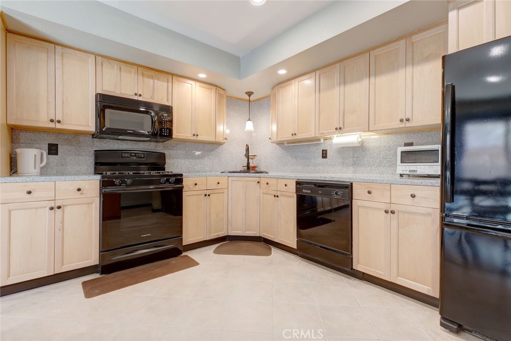 a kitchen with a stove oven and a refrigerator
