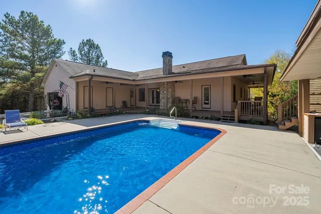 a view of a house with swimming pool