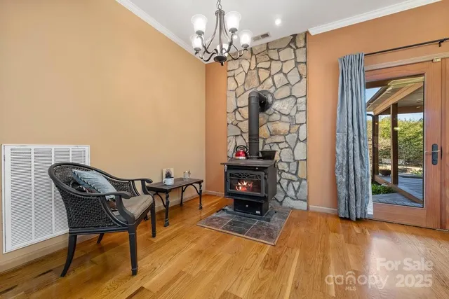 a view of a livingroom with furniture and a chandelier