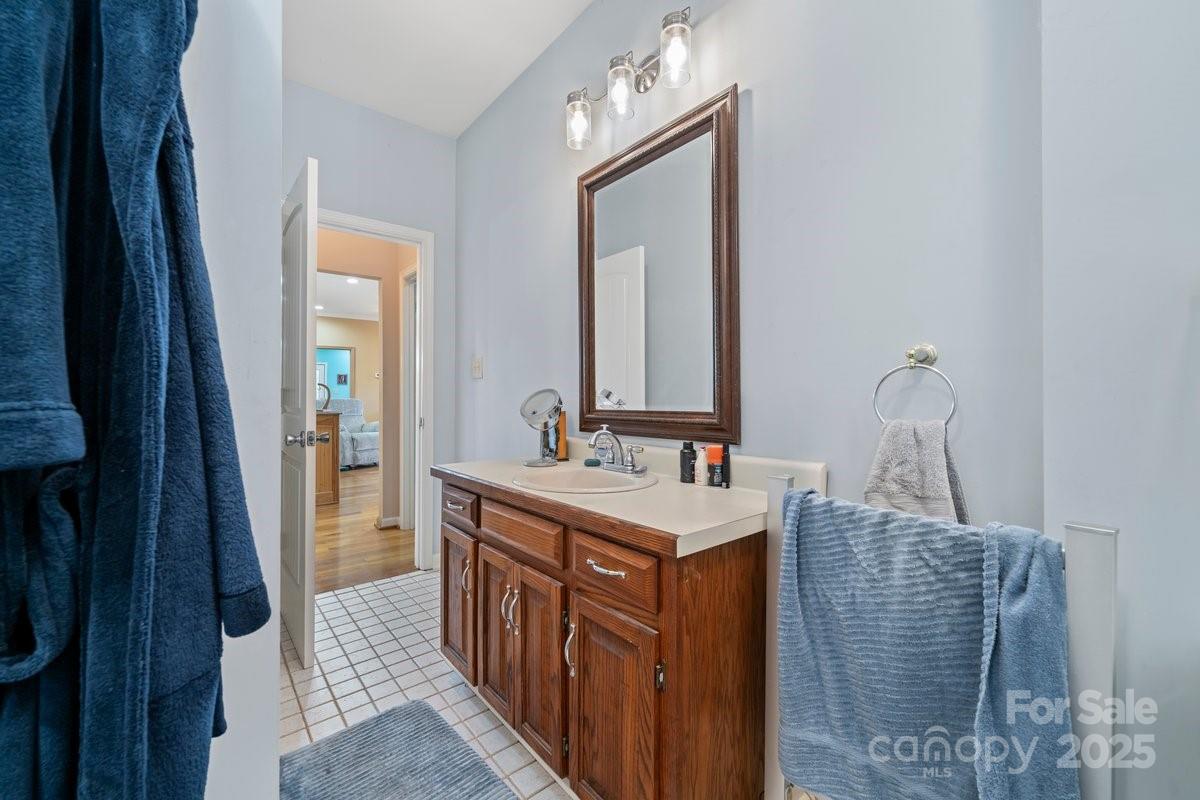 492 State Rd S-11-586 Gaffney, SC 29340 - Photo 18 of 45 a bathroom with a sink a mirror and vanity