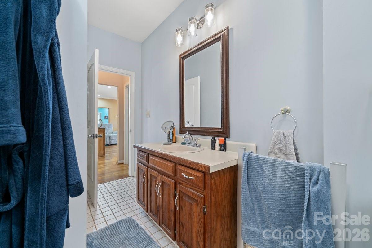 492 State Rd S-11-586 Gaffney, SC 29340 - Photo 18 of 45 a bathroom with a sink a mirror and vanity