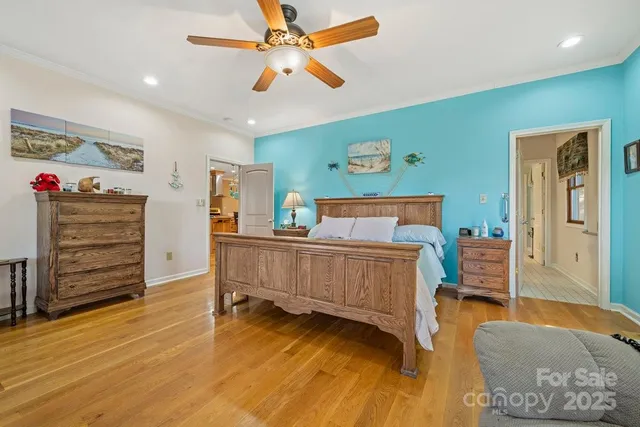 a bedroom with furniture and wooden floor