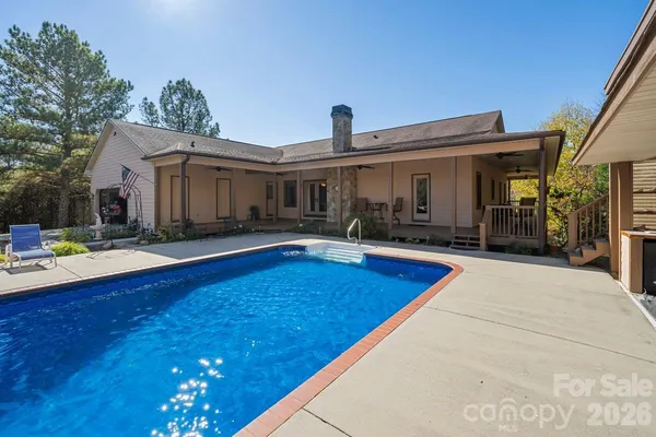a view of a house with swimming pool