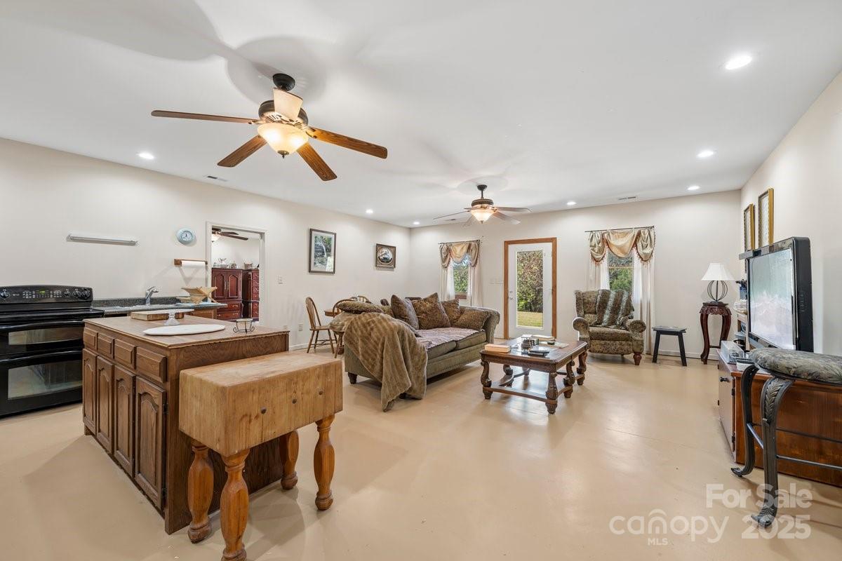 492 State Rd S-11-586 Gaffney, SC 29340 - Photo 26 of 45 a living room with furniture a flat screen tv and kitchen view