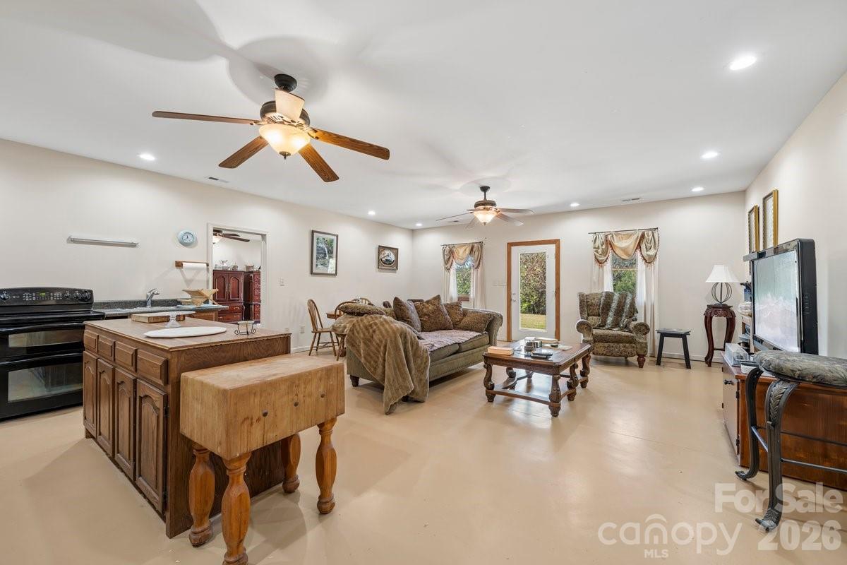 492 State Rd S-11-586 Gaffney, SC 29340 - Photo 26 of 45 a living room with furniture a flat screen tv and kitchen view