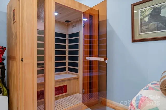 a view of bedroom with hallway and wooden floor