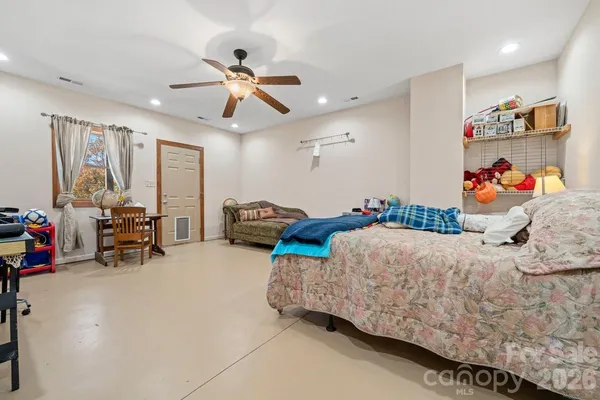 a bedroom with furniture and a bed