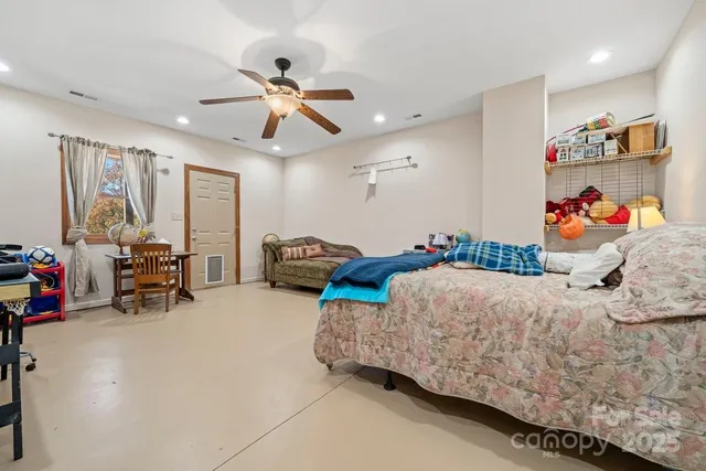 a bedroom with furniture and a bed