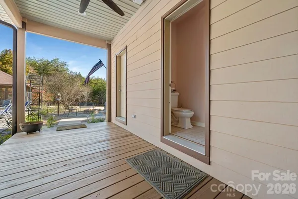 a kitchen with stainless steel appliances granite countertop a kitchen island a stove a table and chairs in it