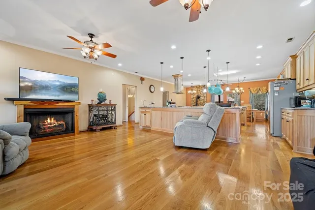 a living room with fireplace furniture and a flat screen tv