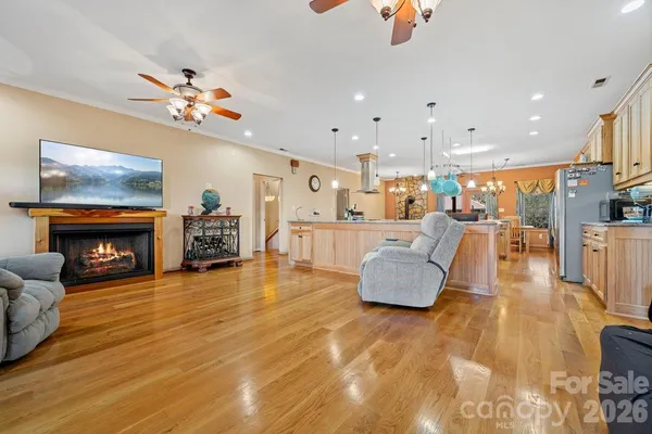 a living room with fireplace furniture and a flat screen tv