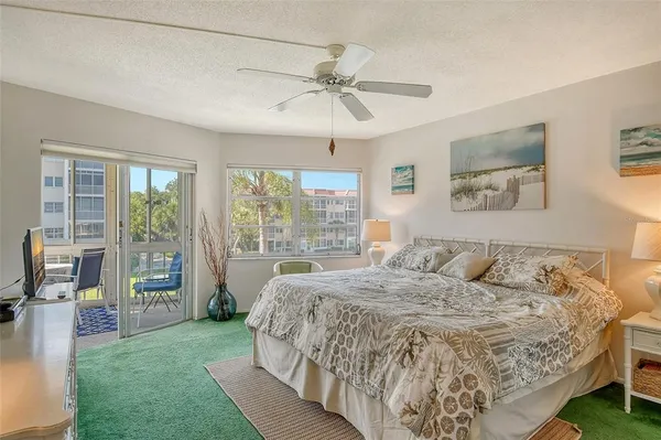 a view of a swimming pool with a yard