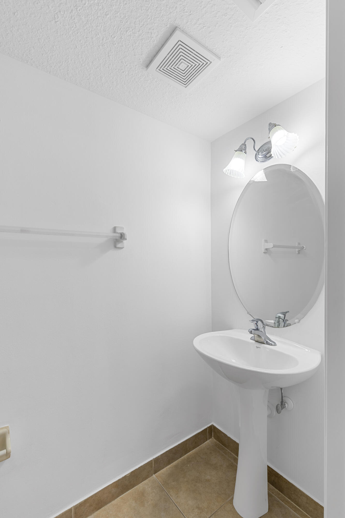 9107 Chambers Street, Unit 9107 Tamarac, FL 33321 - Photo 10 of 30 a bathroom with a sink and a mirror