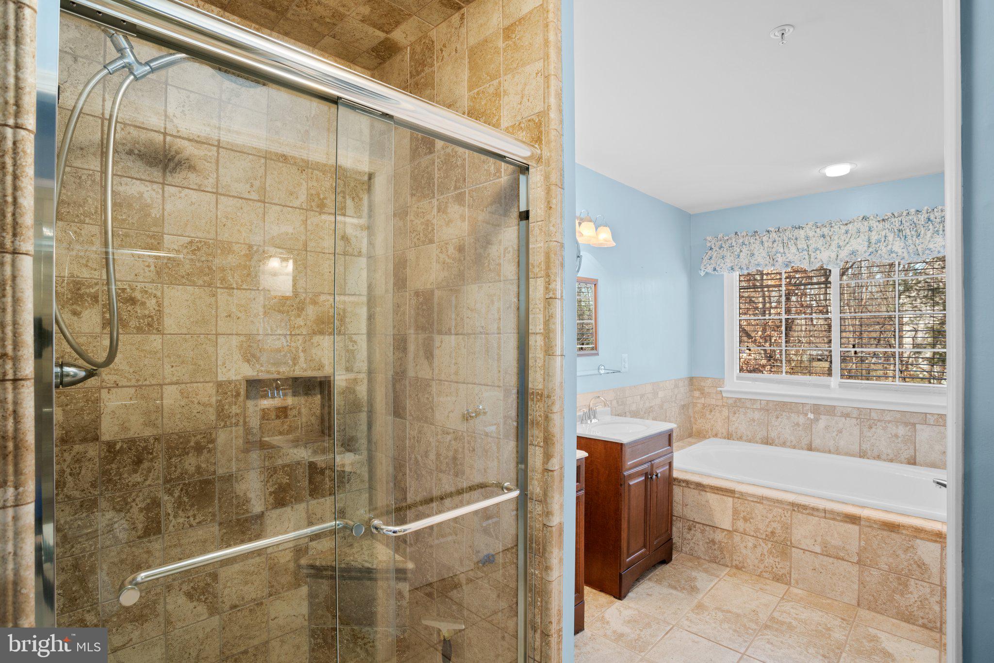 6342 Arbor Way Elkridge, MD 21075 - Photo 15 of 38 a bathroom with a bathtub and a shower