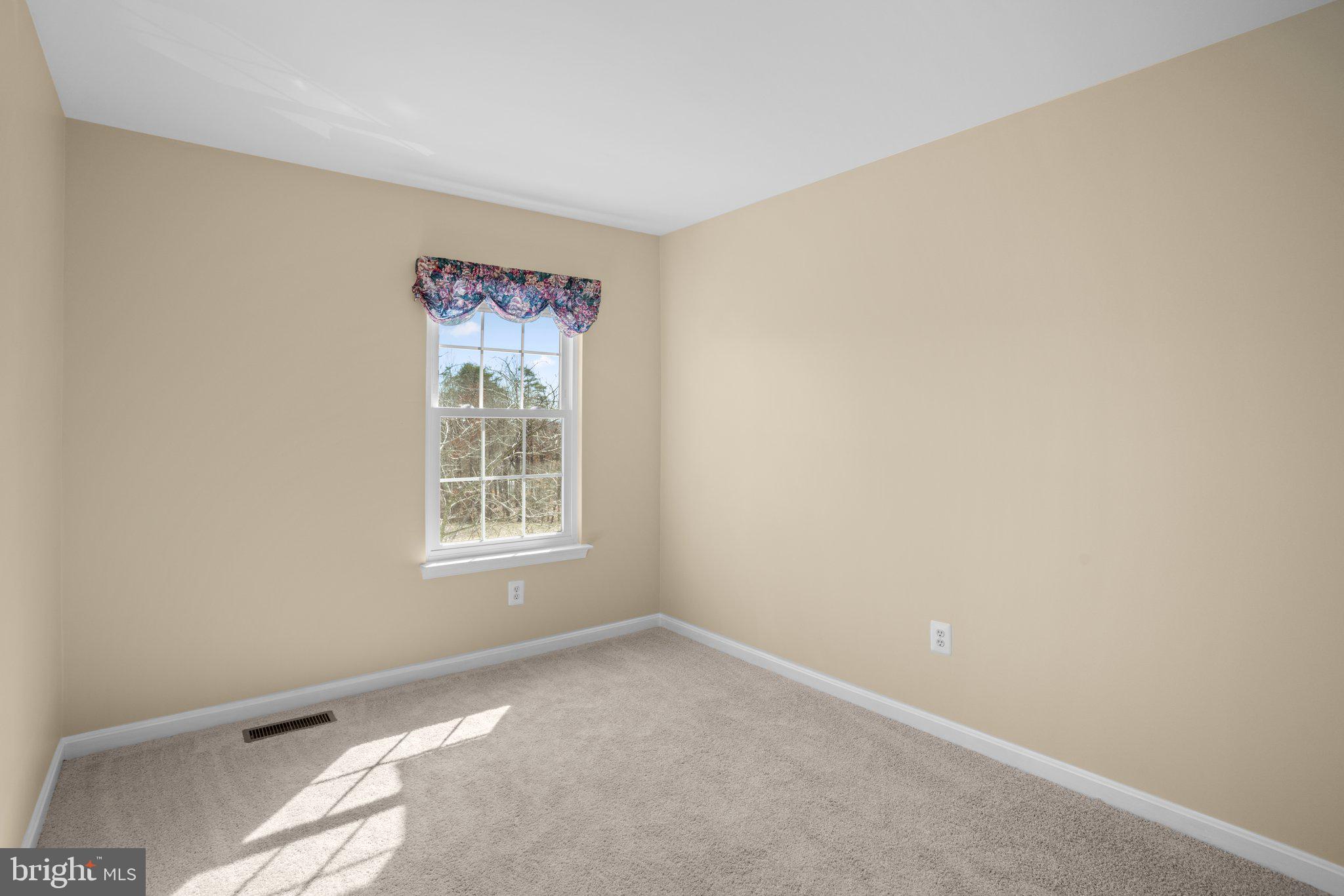 6342 Arbor Way Elkridge, MD 21075 - Photo 18 of 38 a view of an empty room with a window