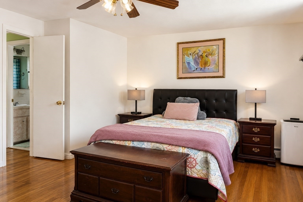 18 Ralston Road Boston, MA 02136 - Photo 8 of 26 a bedroom with a bed and wooden floor