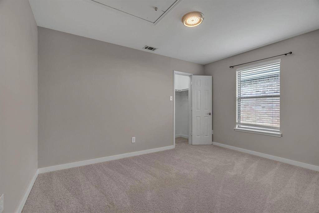 3920 Cane River Road Fort Worth, TX 76244 - Photo 12 of 22 an empty room with a empty space and windows