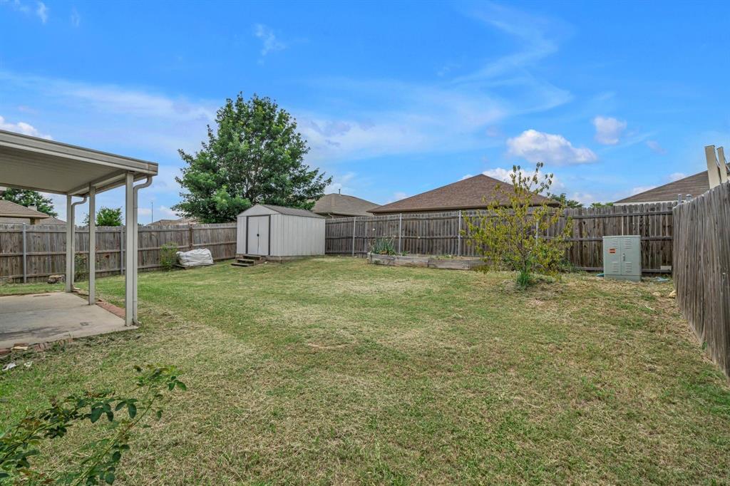 3920 Cane River Road Fort Worth, TX 76244 - Photo 14 of 22 a view of a house with a backyard