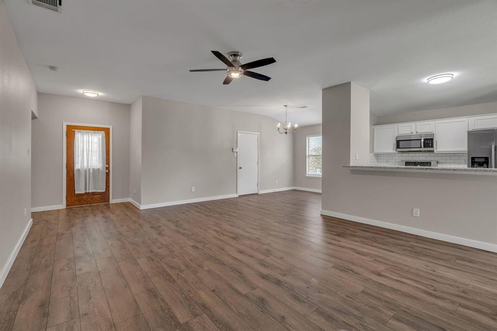 3920 Cane River Road Fort Worth, TX 76244 - Photo 18 of 22 a view of a kitchen with a sink and wooden floor