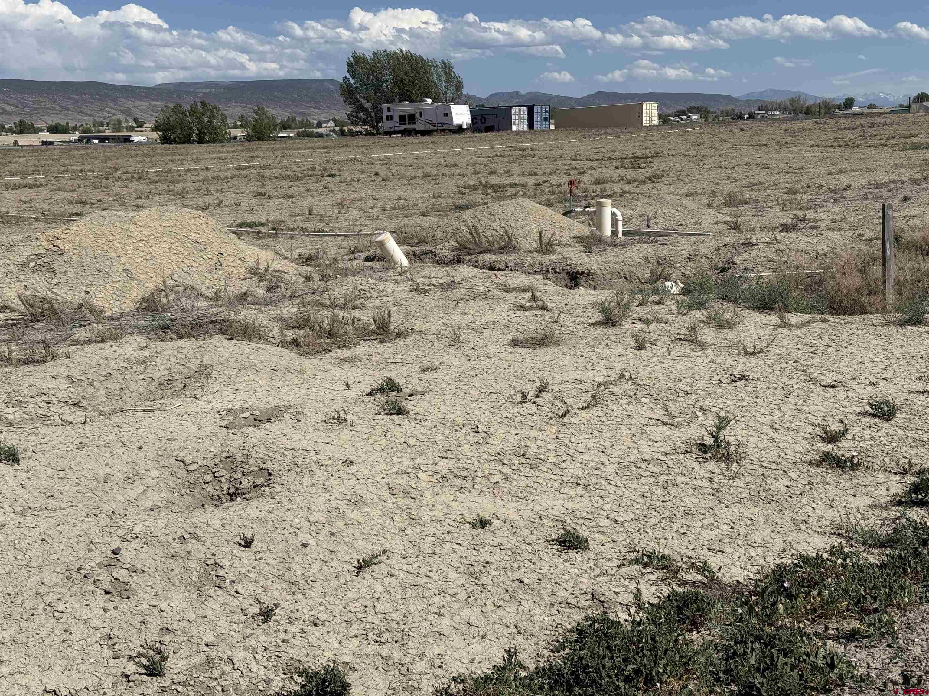 6120 Stirrup Creek Road Delta, CO 81416 - Photo 16 of 16 a view of a lake with beach and mountain