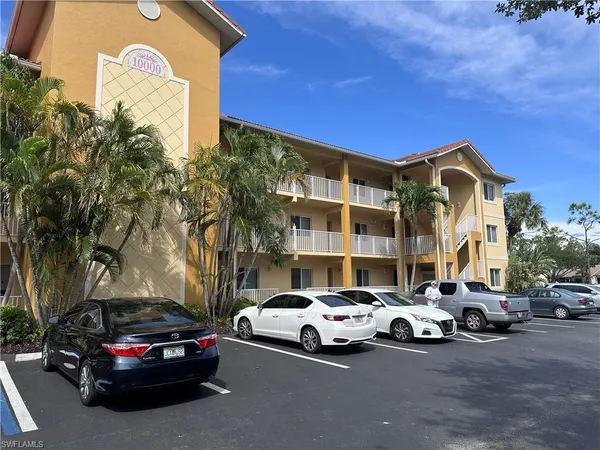 a view of a cars parked in front of a house