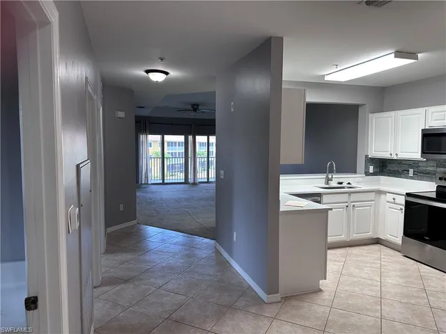 a large bathroom with a sink and a large mirror