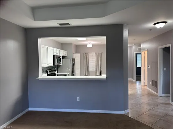 a view of a kitchen cabinets and wooden floor