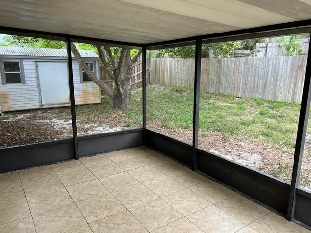 a view of a back yard from a balcony
