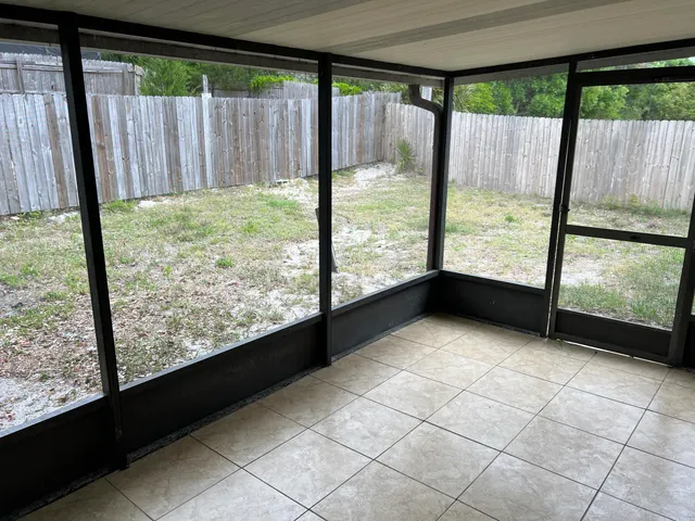 a view of an empty room with a large window