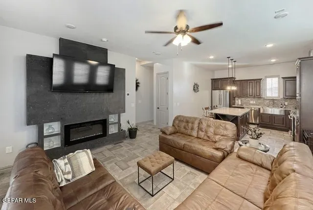 a living room with furniture and a flat screen tv