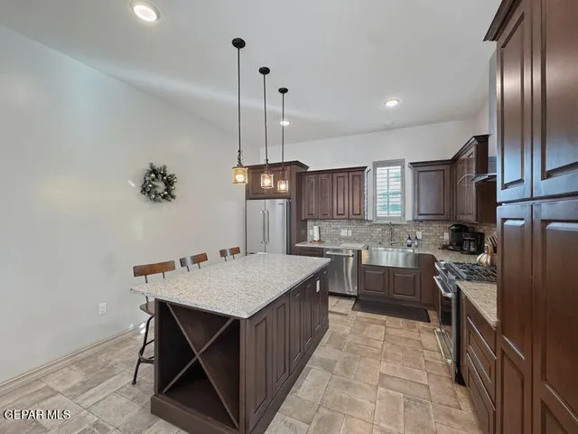 a kitchen with counter space cabinets and appliances