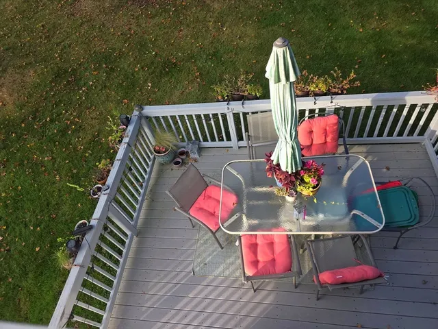 a view of a deck with a yard