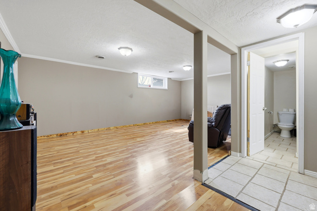 1486 3rd Street Ogden, UT 84404 - Photo 17 of 26 Lower-level living area featuring wood-finish flooring, recessed lighting, and a window