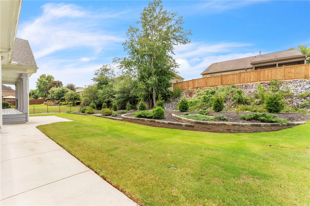 1015 Winmar Drive Anderson, SC 29621 - Photo 42 of 49 This spacious yard offers a vibrant green lawn and beautifully terraced landscaping.