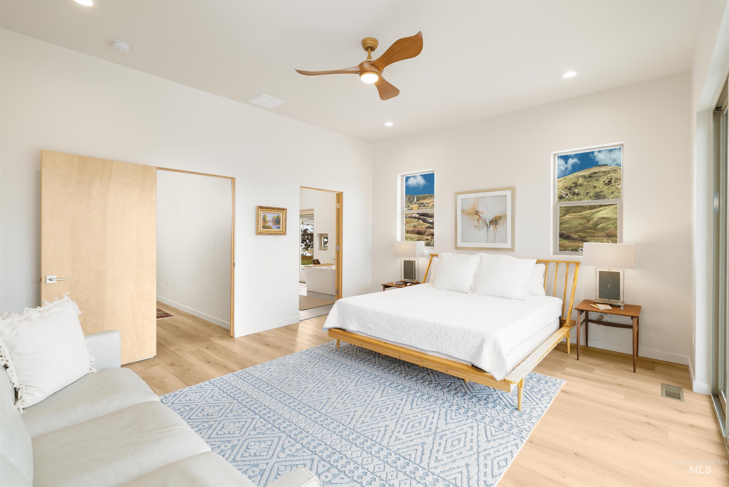 170 Summit Ridge Road Horseshoe Bend, ID 83629 - Photo 17 of 50 Bedroom with light wood finished floors, a closet, recessed lighting, and ceiling fan