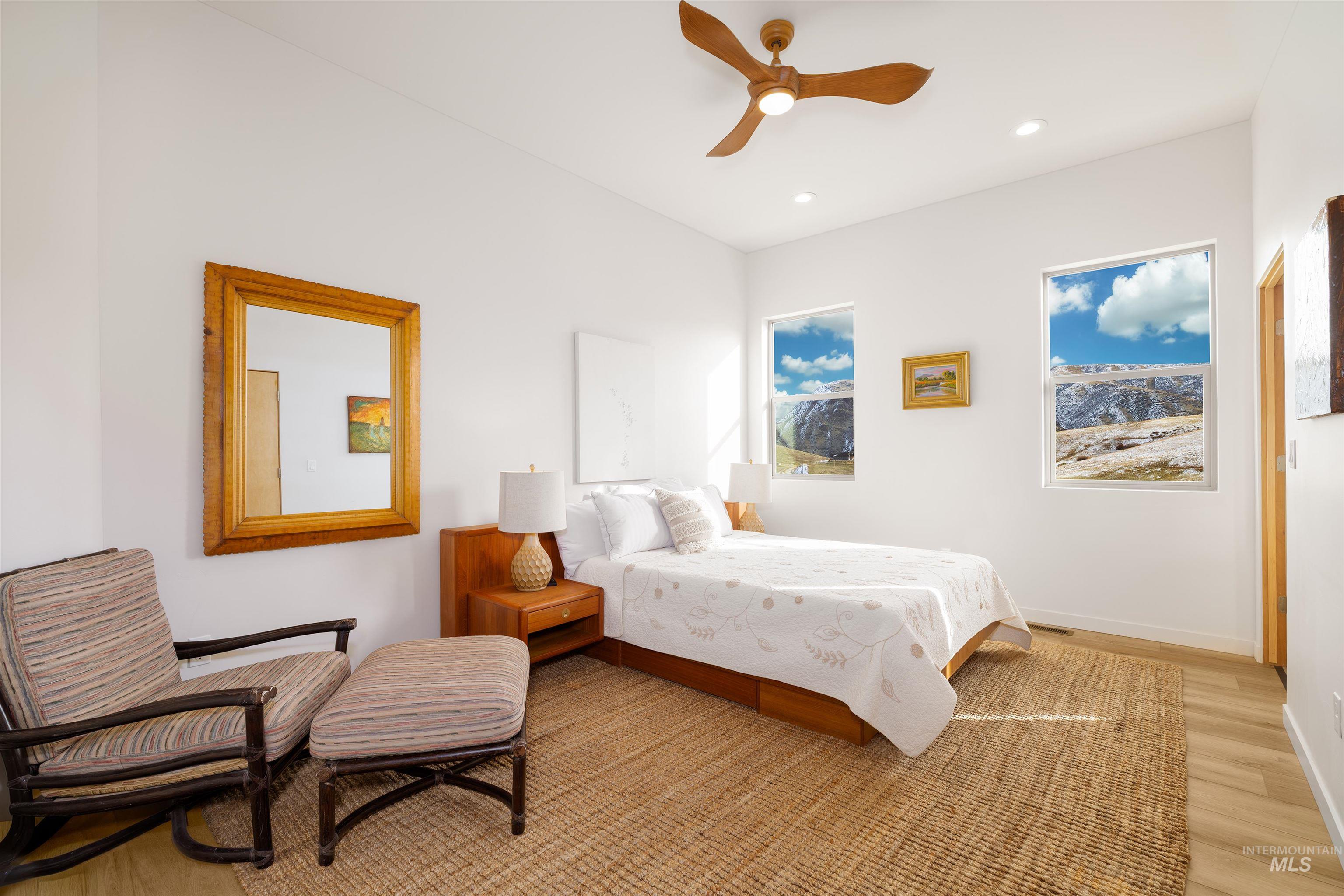 170 Summit Ridge Road Horseshoe Bend, ID 83629 - Photo 21 of 50 Bedroom with wood finished floors, a ceiling fan, and recessed lighting