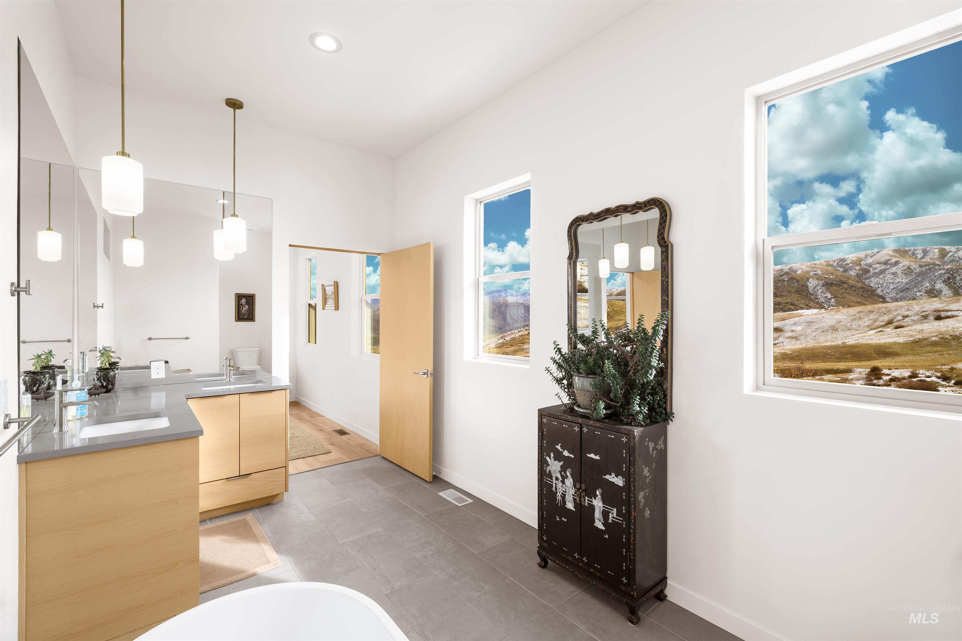 170 Summit Ridge Road Horseshoe Bend, ID 83629 - Photo 24 of 50 Full bath featuring double vanity, a freestanding tub, and recessed lighting