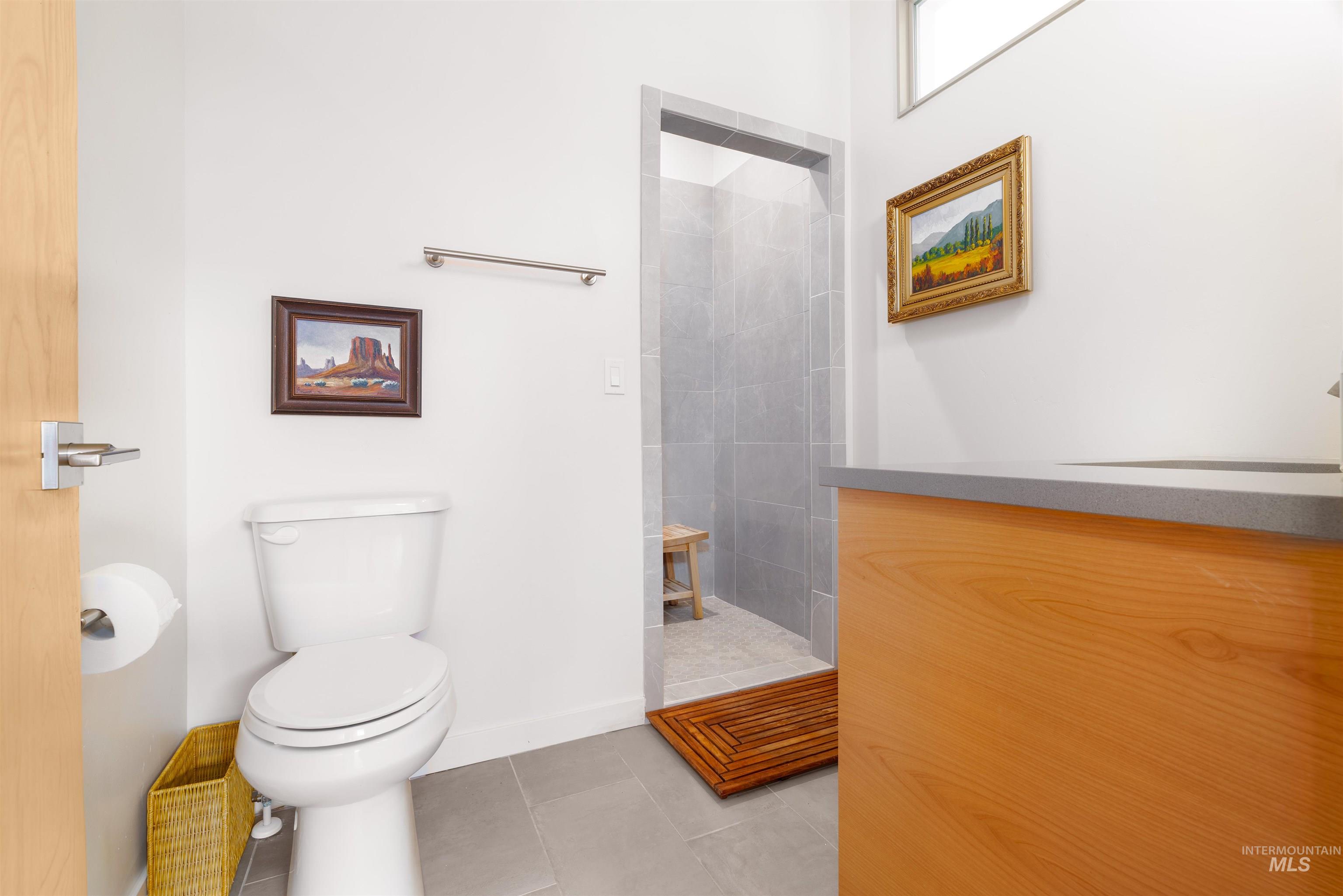 170 Summit Ridge Road Horseshoe Bend, ID 83629 - Photo 26 of 50 Bathroom with a tile shower, light tile patterned floors, and vanity