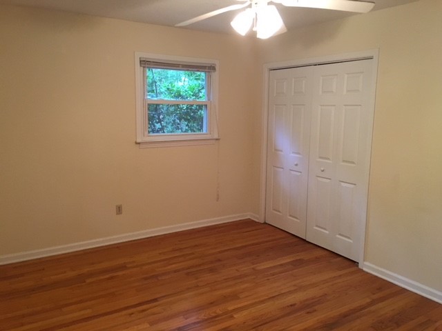 216 Lacustrian Lane, Unit 25 Central, SC 29630 - Photo 3 of 8 This cozy bedroom features polished hardwood flooring and a functional closet.