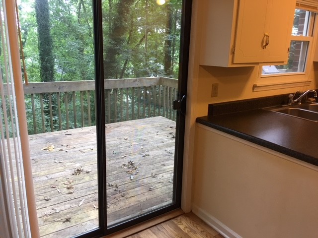 216 Lacustrian Lane, Unit 25 Central, SC 29630 - Photo 5 of 8 This outdoor deck provides a serene connection to nature, ideal for relaxation.